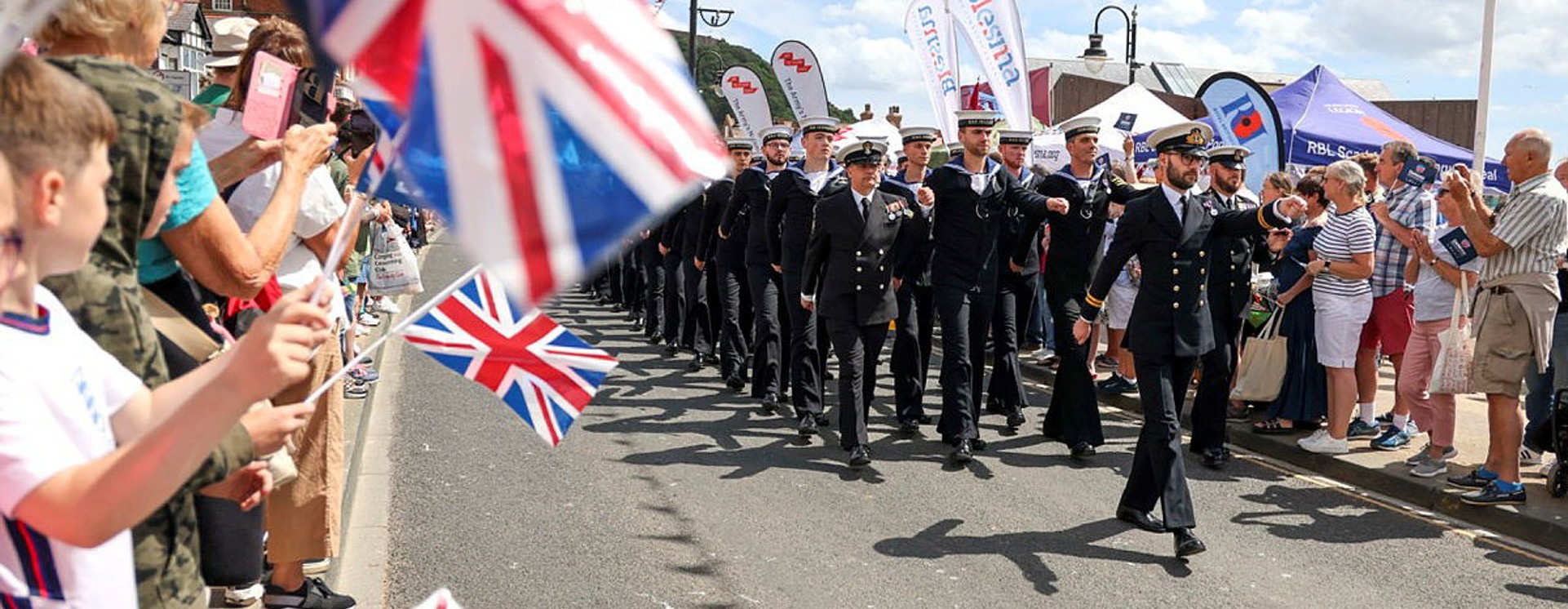 Military personnel parade on Armed Forces Day in UK